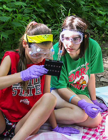 Young women explore biodiversity through science.