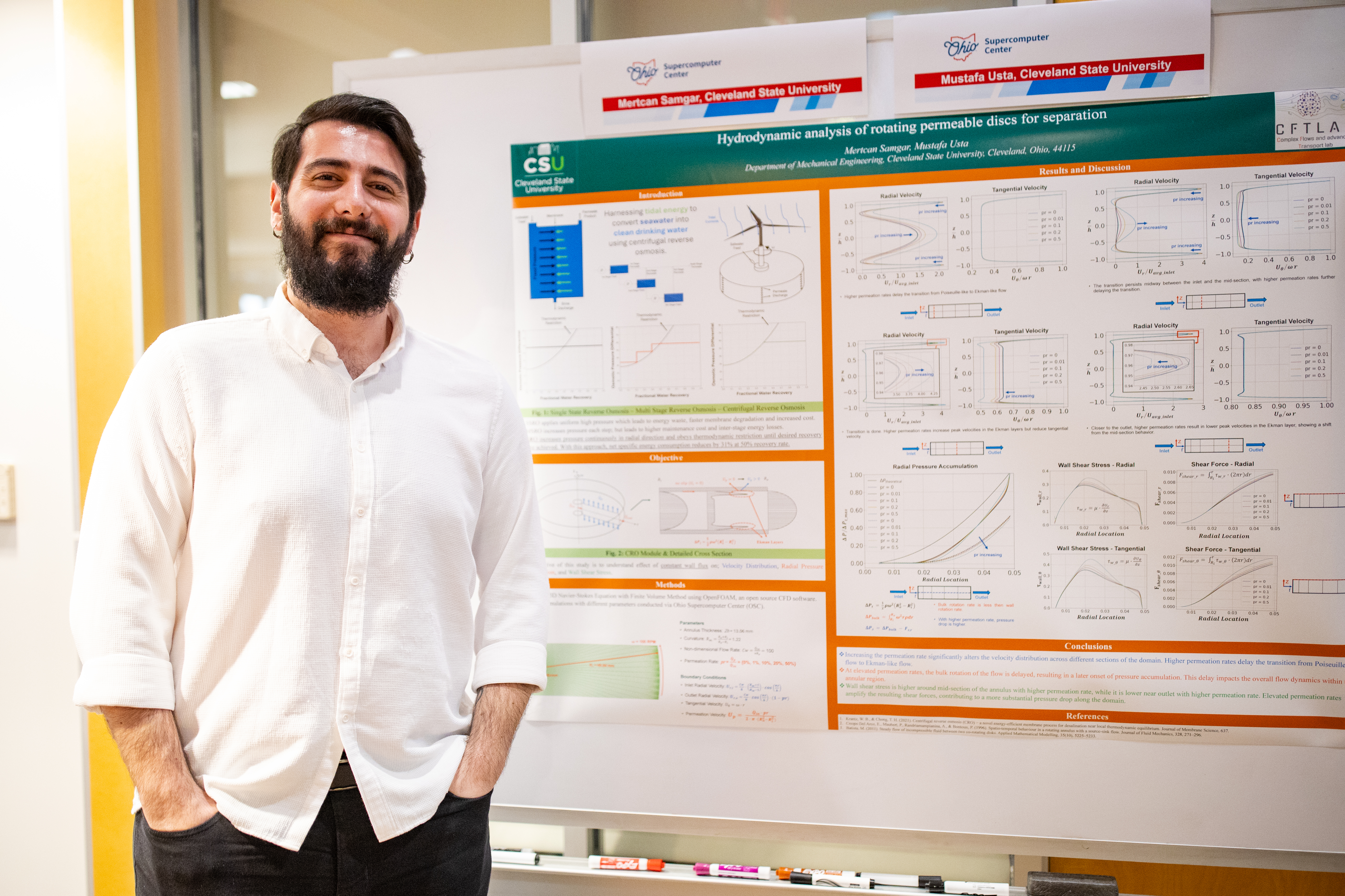 Researching presenting poster at Research Symposium.