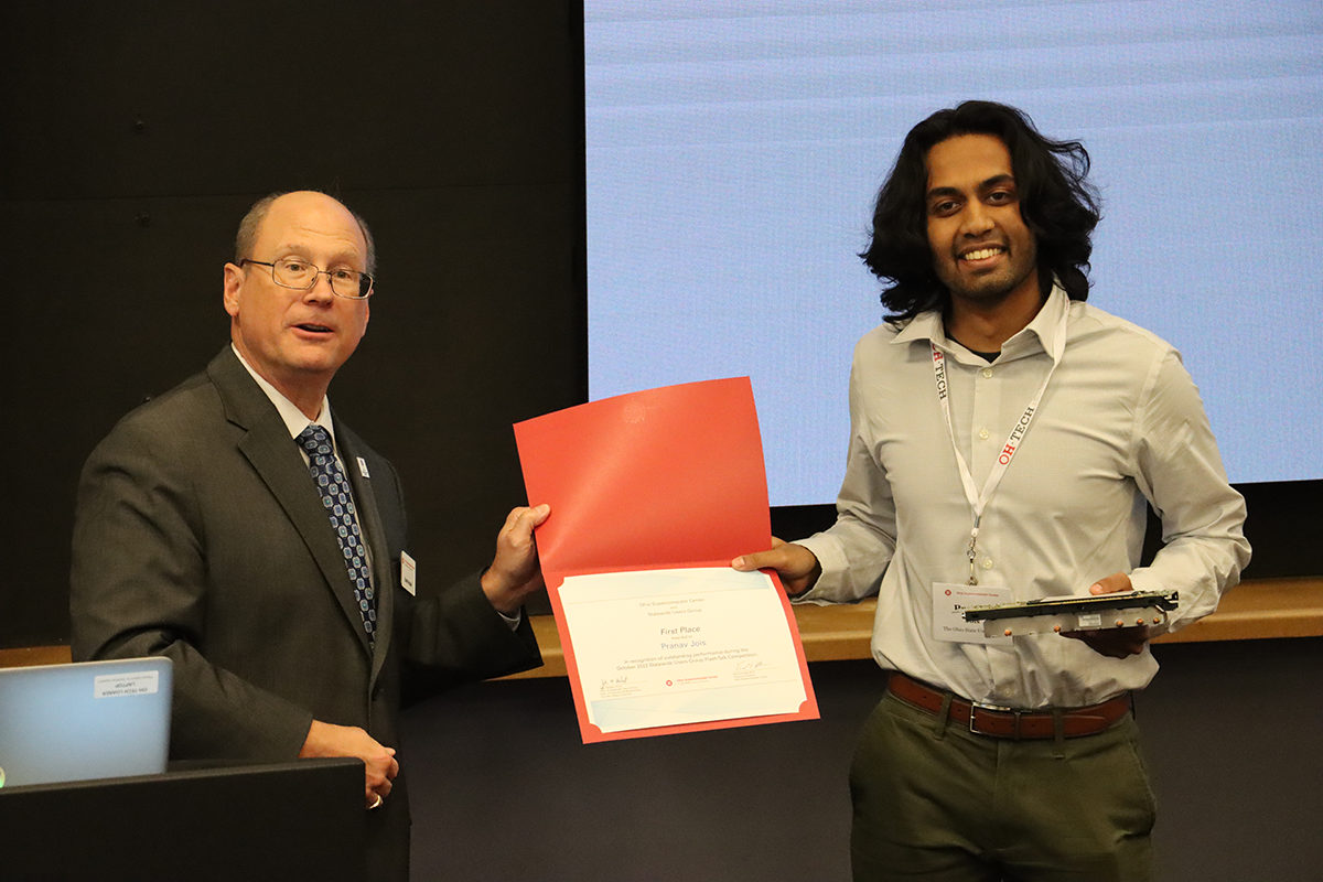 Pranav Jois, Fall 2022 SUG Flash Talk winner, posing with OSC Executive Director Dave Hudak holding First Place certificate