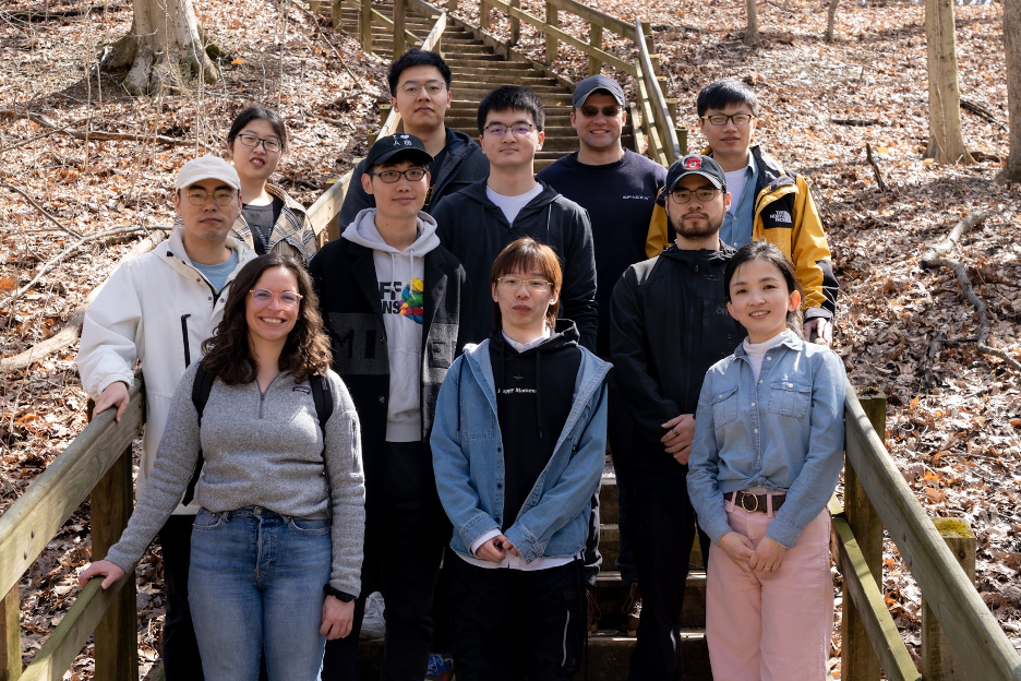 Huan Sun's research group posing for a photo outside.