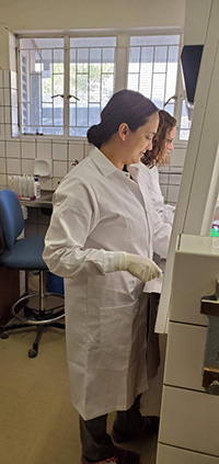 Kamath handles samples in laboratory in Etosha National Park, Namibia.