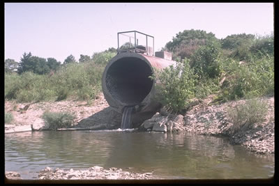 Industrial pipes discharge wastes directly to streams